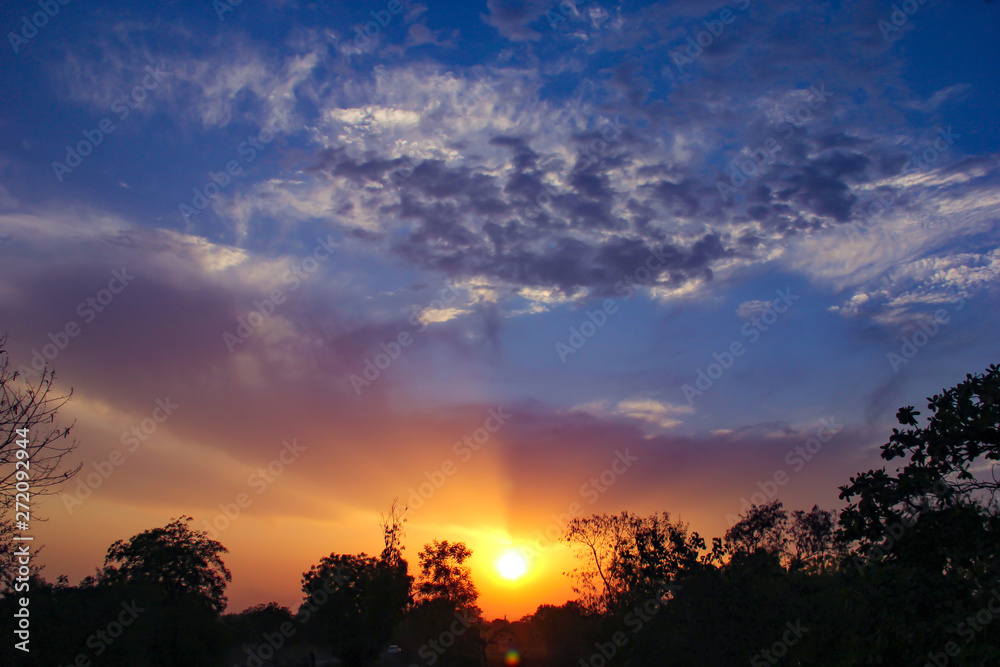 Fototapeta premium Sunset / sunrise with clouds, Panoramic view of a cloudy sky at sunset 