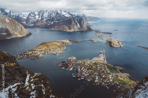 Scenic landscape of Lofoten islands: peaks, lakes, and houses. Reine village, rorbu, reinbringen