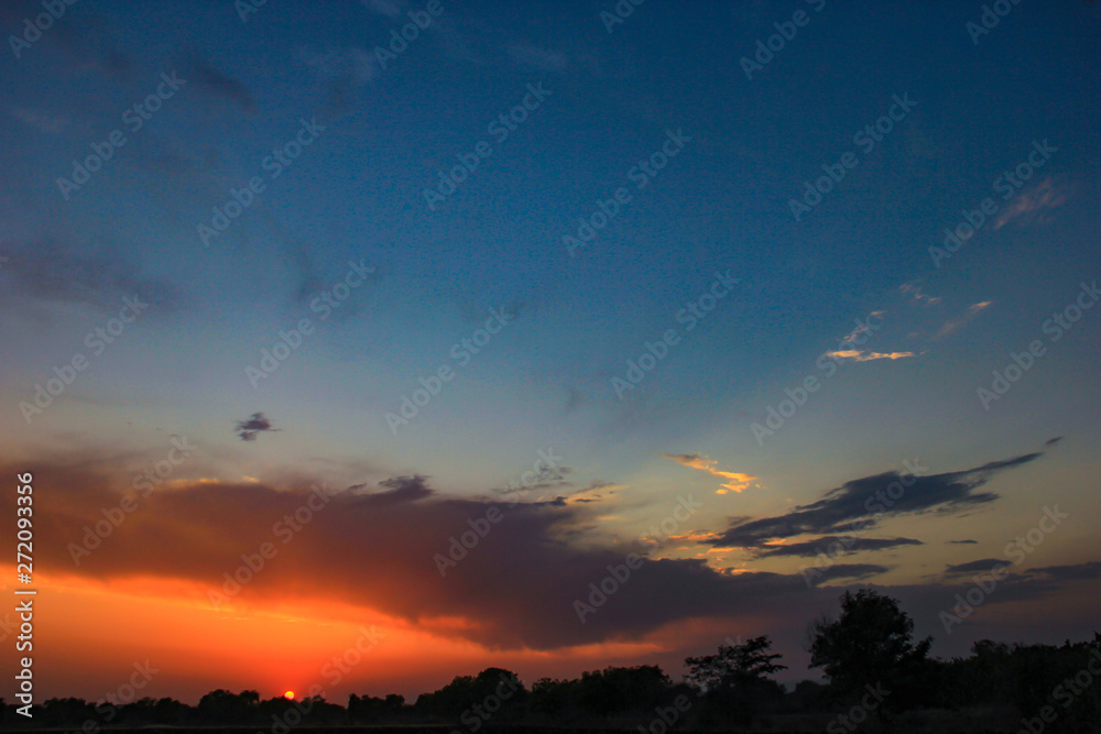 Fototapeta premium Sunset / sunrise with clouds, Panoramic view of a cloudy sky at sunset