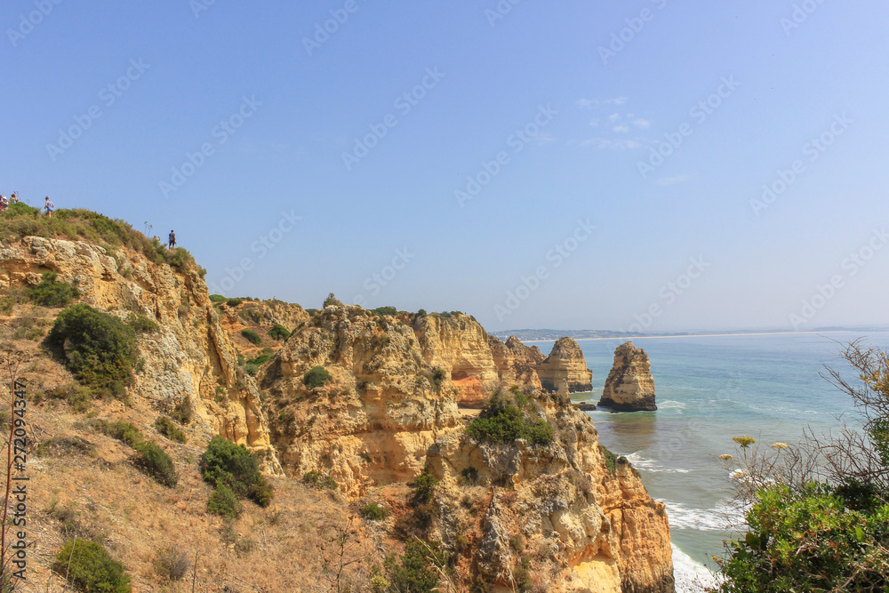 Beautiful golden cliffs and emerald water in Ponta da Piedade, Lagos, Algarve, Portugal Beautiful golden cliffs and emerald water in Ponta da Piedade, Lagos, Algarve, Portugal