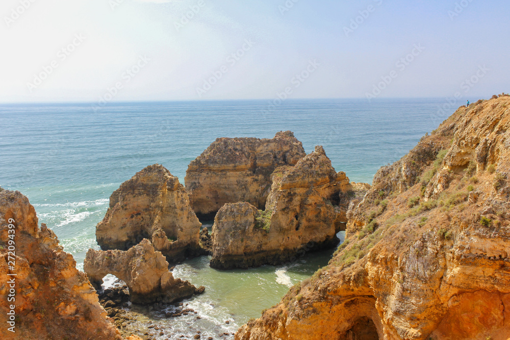 Beautiful golden cliffs and emerald water in Ponta da Piedade, Lagos, Algarve, Portugal