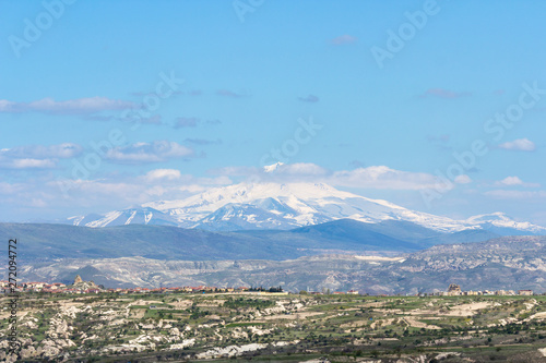 View of the Mount Erciyes ( Turkish: Erciyes Dagi ) from Uchisar Castle in Cappadocia Region. Also known as Argaeus, is a volcano in Turkey. photo