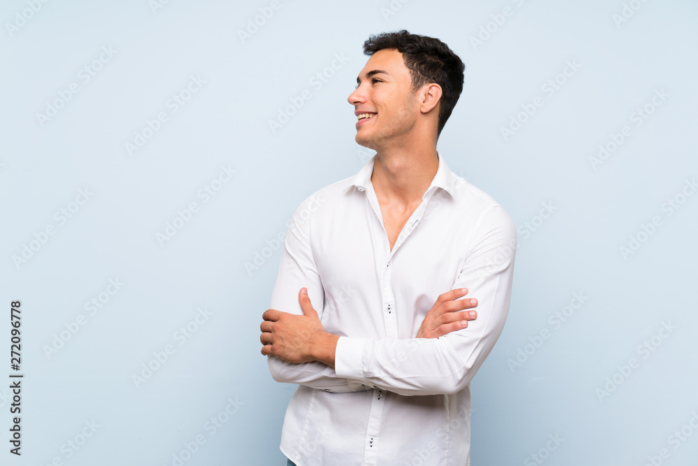 Handsome man over blue wall happy and smiling Handsome man over blue wall happy and smiling