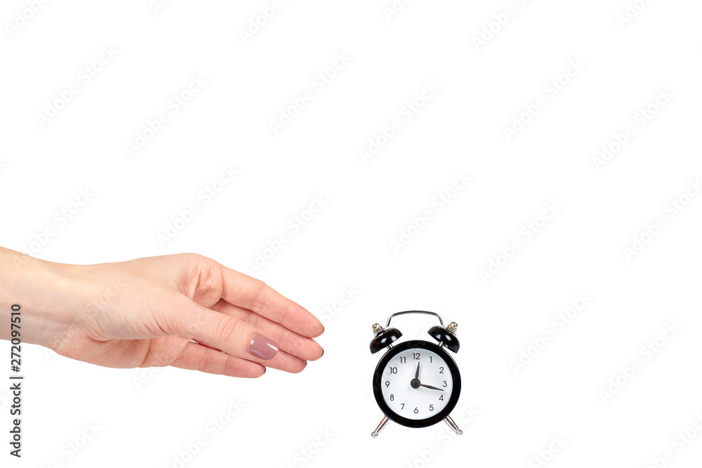 Hand with black retro alarm clock, classic watches with bells.