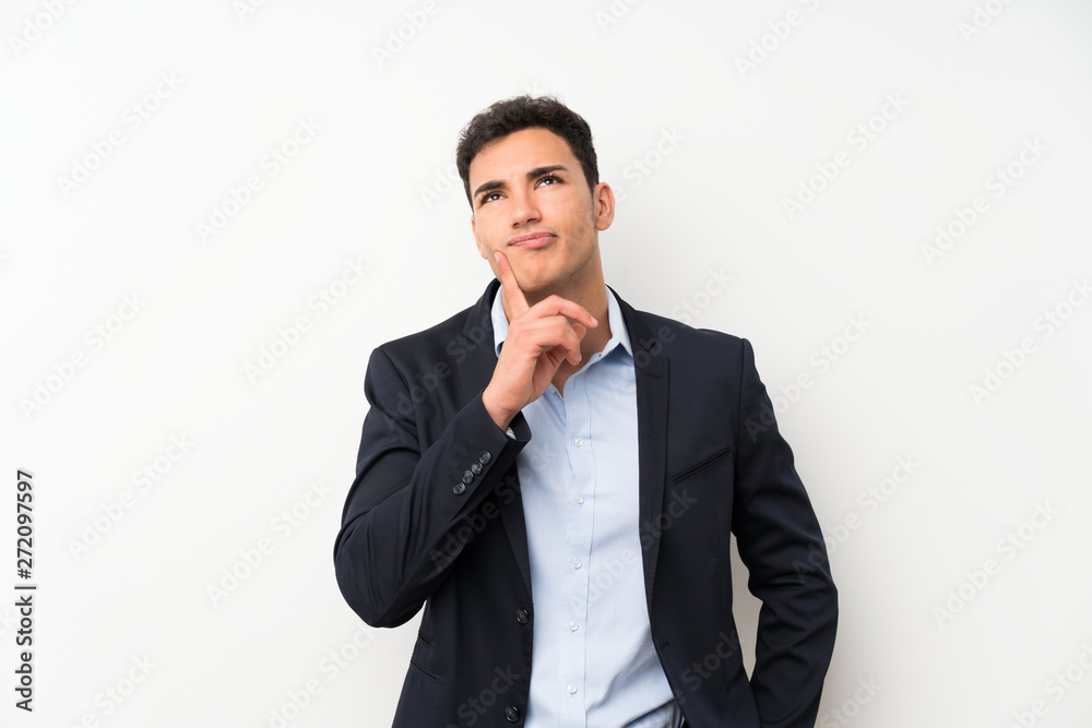 Handsome man over isolated white wall thinking an idea Handsome man over isolated white wall thinking an idea