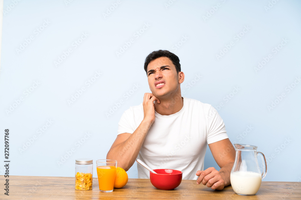 Handsome man in having breakfast thinking an idea Handsome man in having breakfast thinking an idea