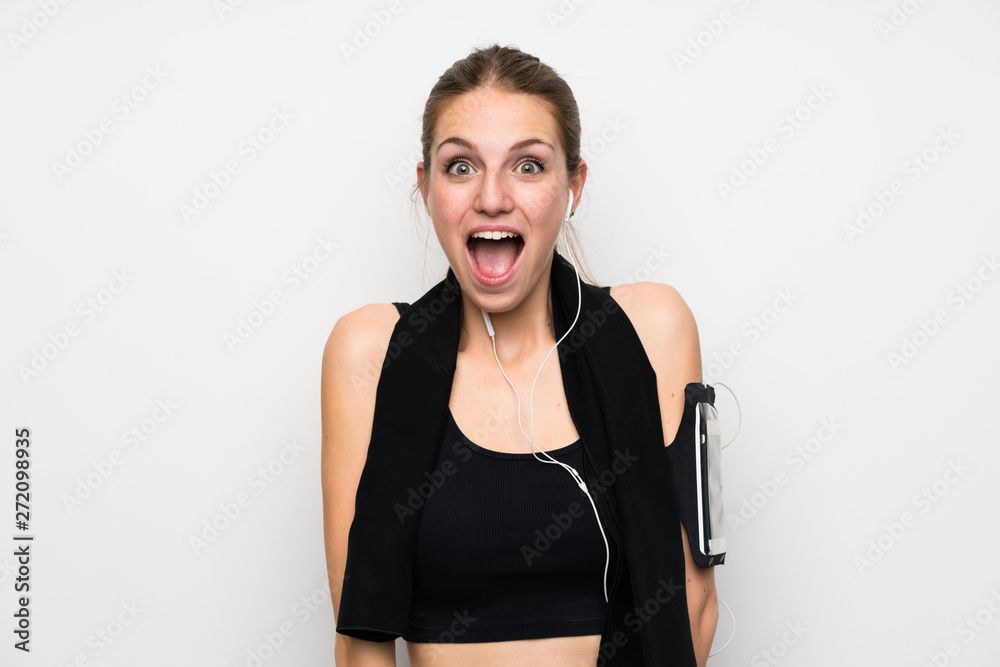 Young sport woman over isolated white background with surprise facial expression Young sport woman over isolated white background with surprise facial expression