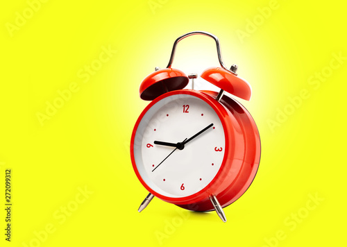 Red alarm clock isolated on white