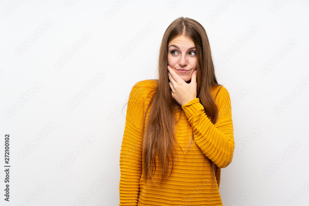 Young woman with yellow over isolated white wall thinking an idea Young woman with yellow over isolated white wall thinking an idea