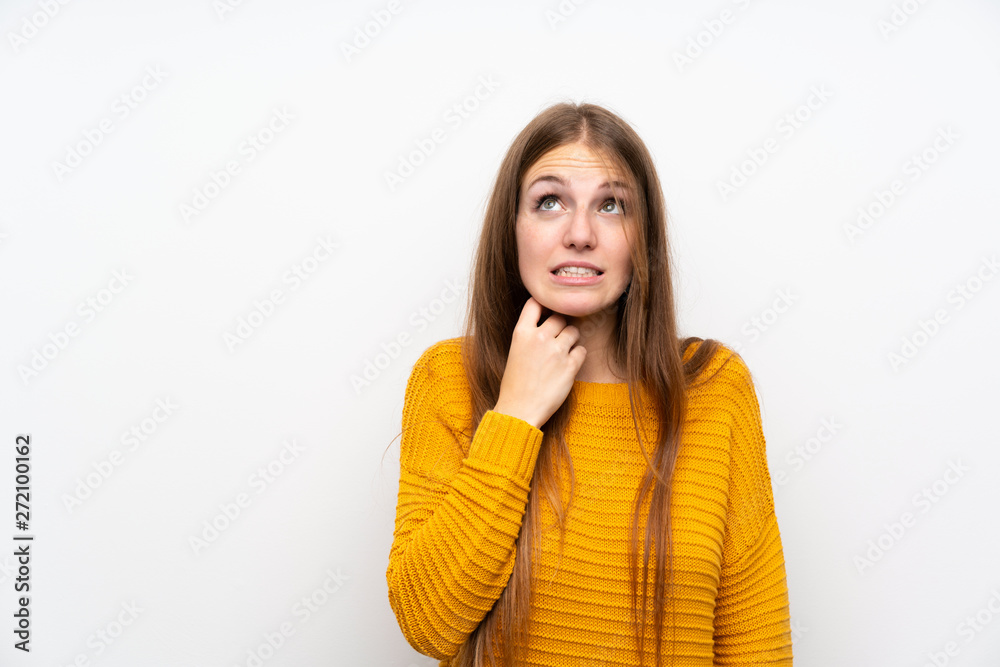 Young woman with yellow over isolated white wall standing and thinking an idea Young woman with yellow over isolated white wall standing and thinking an idea