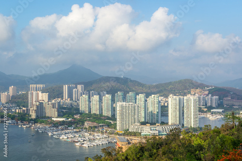 View of one of the districts of Sanya city. Visible are the skyscrapers and the public ferry terminal. Hainan Island, China. © Amateur007