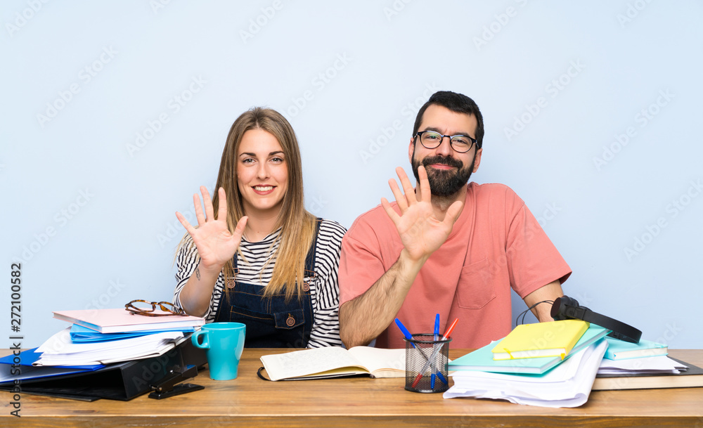 Students with many books counting five with fingers
