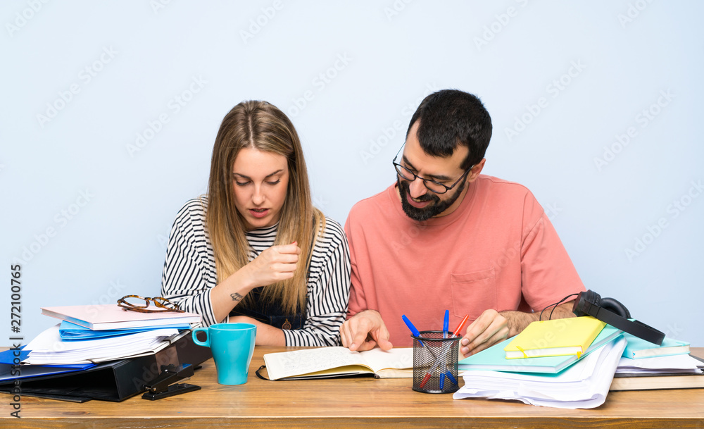 Two students with many books Two students with many books