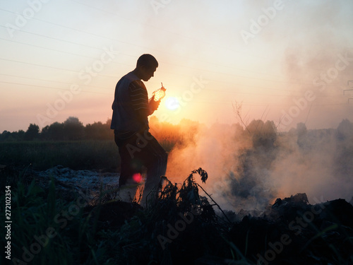 Fototapeta Naklejka Na Ścianę i Meble -  Fire in the field. Volunteers fighting the fire