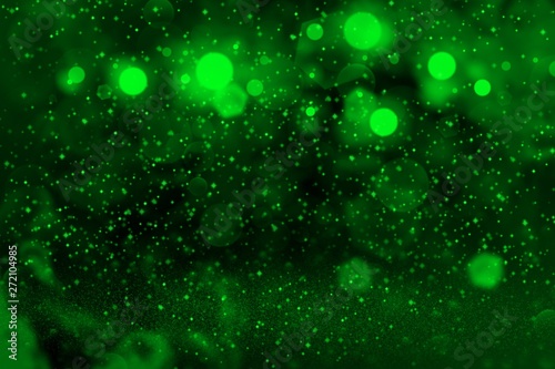green fantastic shining glitter lights defocused bokeh abstract background with sparks fly, festal mockup texture with blank space for your content