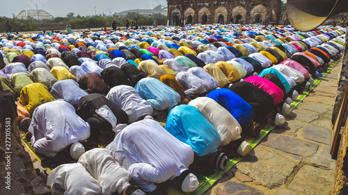 Photos A gathering of Muslim men and children bowing down and offering Namaz prayers on the occasion of Eid'Al-Fitr 2019