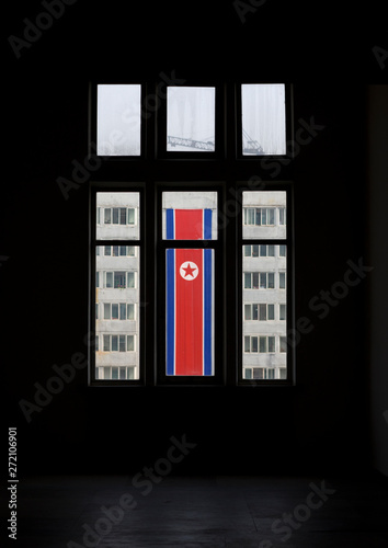 National flag seen thru the window of building, Pyongan Province, Pyongyang, North Korea photo