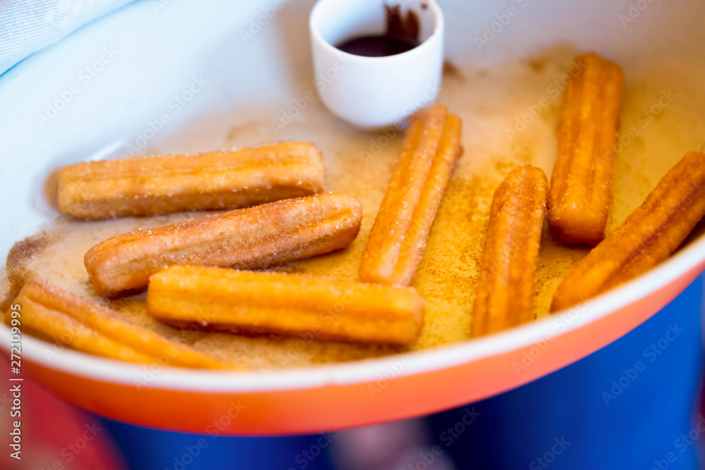 Churros with cinnamon sugar and chocolate sauce Churros with cinnamon sugar and chocolate sauce