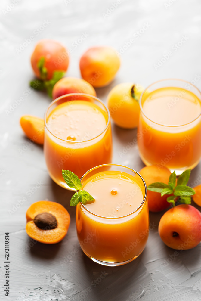 Fresh apricot juice on the marble table Fresh apricot juice on the marble table