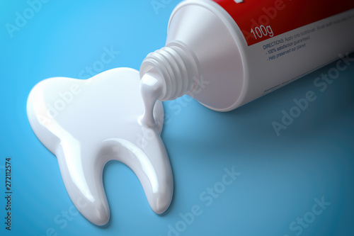 Toothpaste in the shape of tooth coming out from toothpaste tube. Brushing teeth dental concept. photo