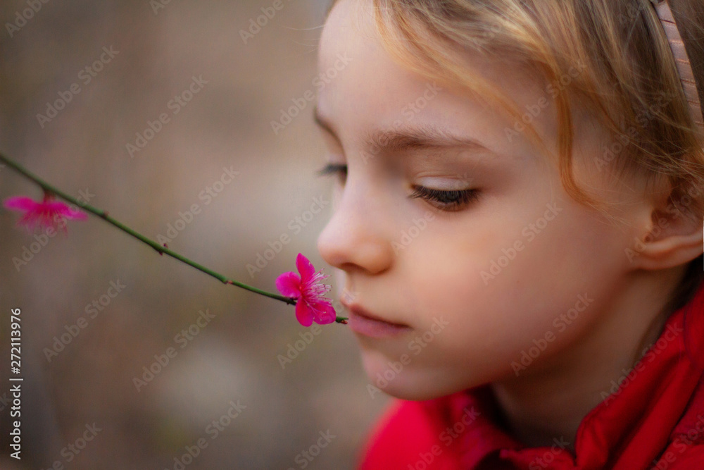 portrait of a beautiful little girl with flowers portrait of a beautiful little girl with flowers