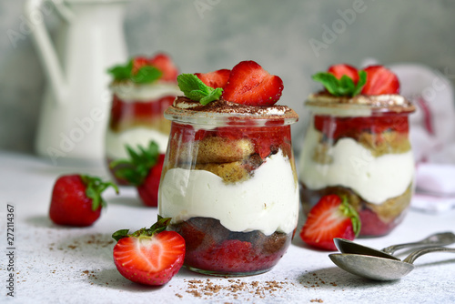 Homemade traditional italian dessert tiramisu with fresh strawberry.