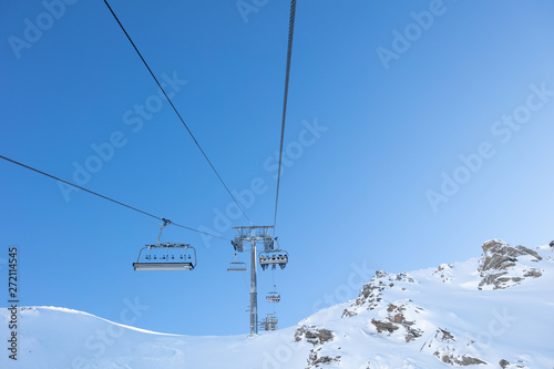 Ski lift going up the mountain photo