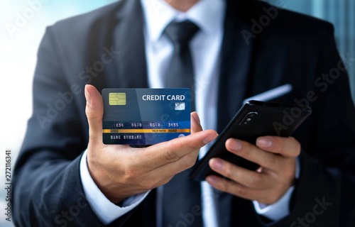 Businessman pay or shopping by credit card with smartphone