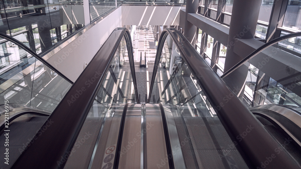 Moving escalator in interior of office building