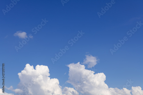 Summer blue sky with soft white clouds background