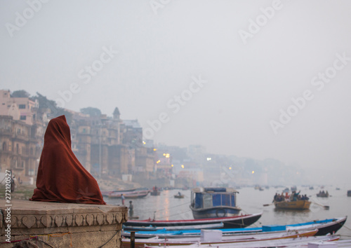 Meditation in front of Ganges river in the morning, Varanasi, India