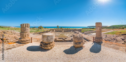 Panorama view of the ancient Romans ruins of Baelo Claudia, next to the beach of Bolonia, near Tarifa in Cadiz in the south of Spain. photo