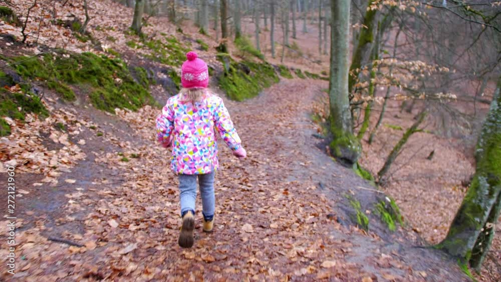 Young Girl Running in Autumn Forest on Fallen Leaves Flycam Tracking Shot Young Girl Running in Autumn Forest on Fallen Leaves Flycam Tracking Shot