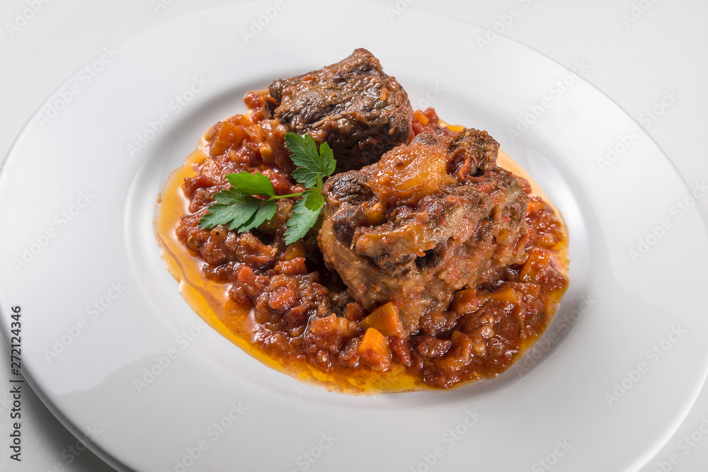 Dish with portion of oxtail stewed Dish with portion of oxtail stewed