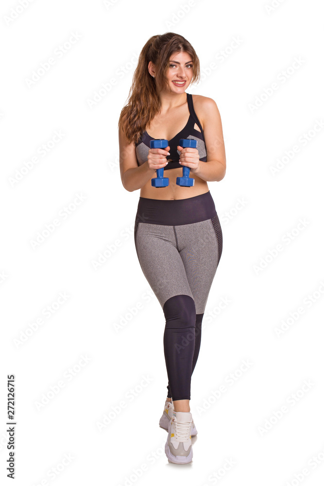 Sporty beautiful woman exercising to stay fit training with dumbbells. Healty lifestyle concept Sporty beautiful woman exercising to stay fit training with dumbbells. Healty lifestyle concept