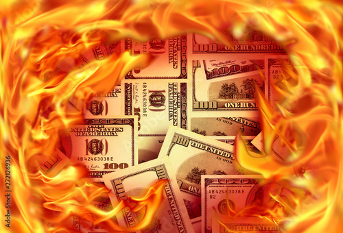 Conceptual finance image of burning pile dollar bill and fire flames