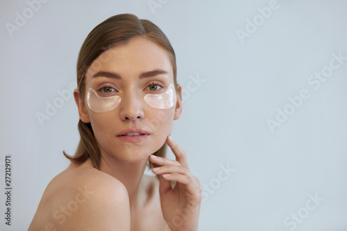 Obraz na płótnie Eye skin care. Woman with beauty patch mask under eyes portrait