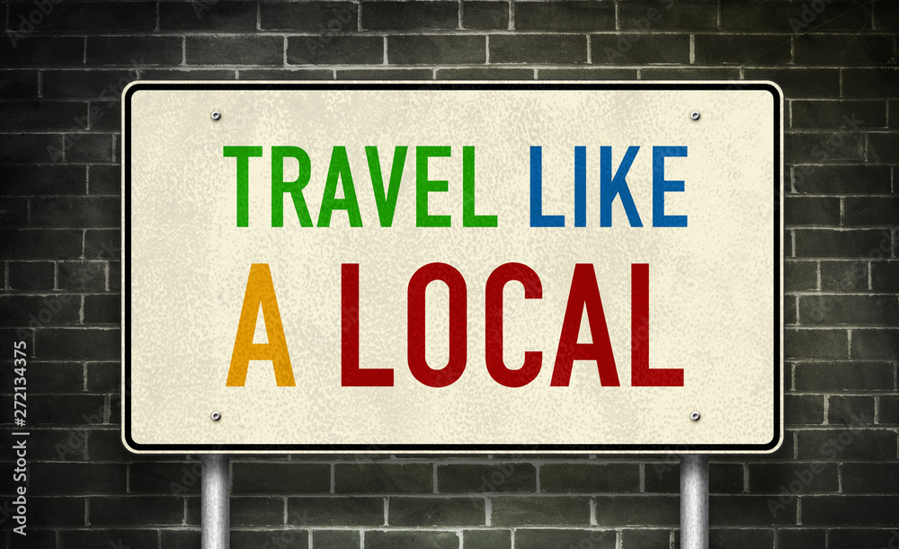 Fototapeta premium Travel like a local - road sign message
