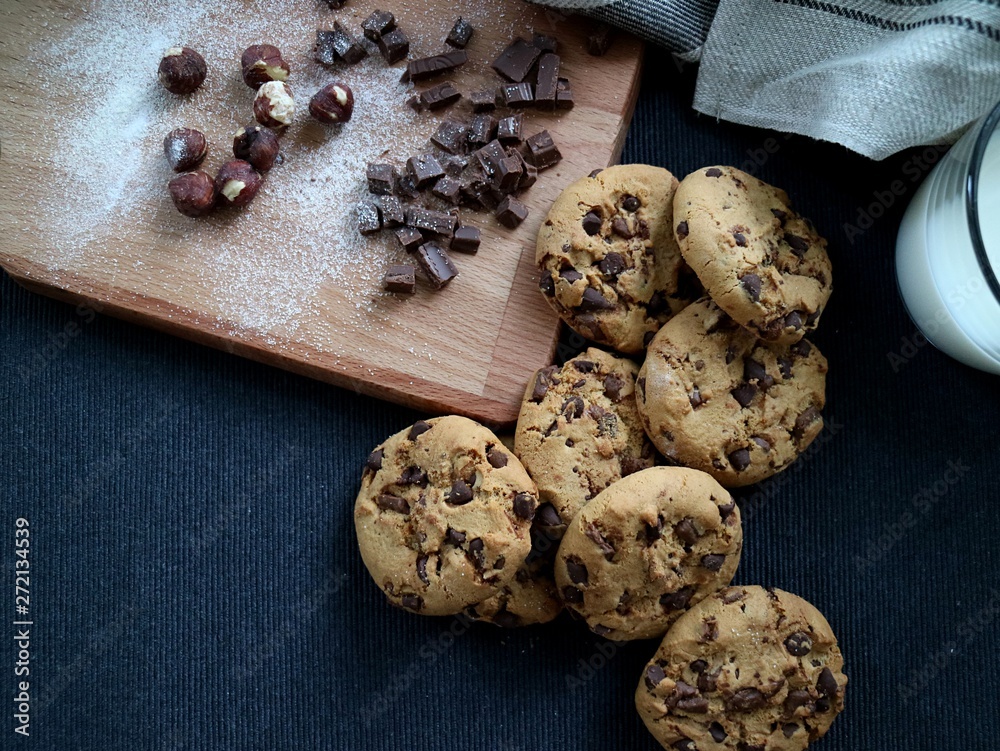 homemade american cookies with nuts, chocolate chips and milk homemade american cookies with nuts, chocolate chips and milk
