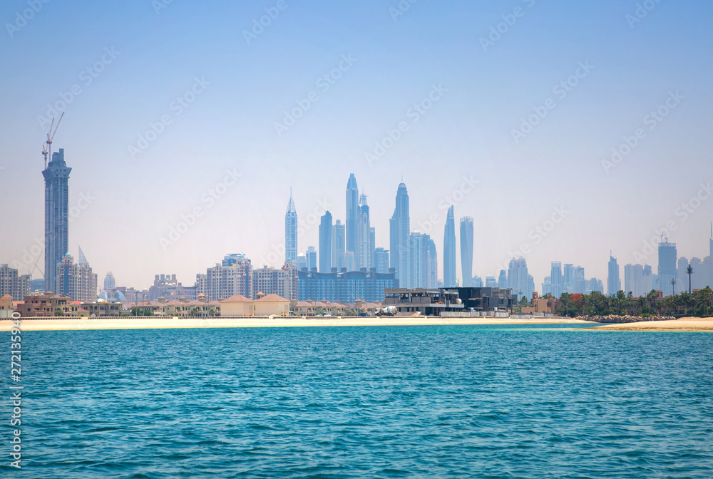 Obraz premium Dubai Marina skyscrapers and villas on the Palm Jumeirah. Luxury properties of UAE