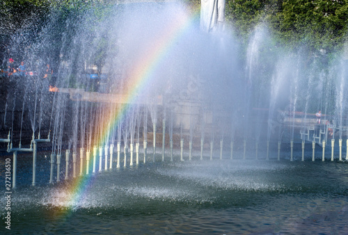 Rainbow on the fountain of the city Park.