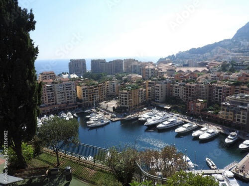 Panoramic view of harbor with boats and skyline of Monaco on sunny summer day, French Riviera, Monaco . © Konstantin