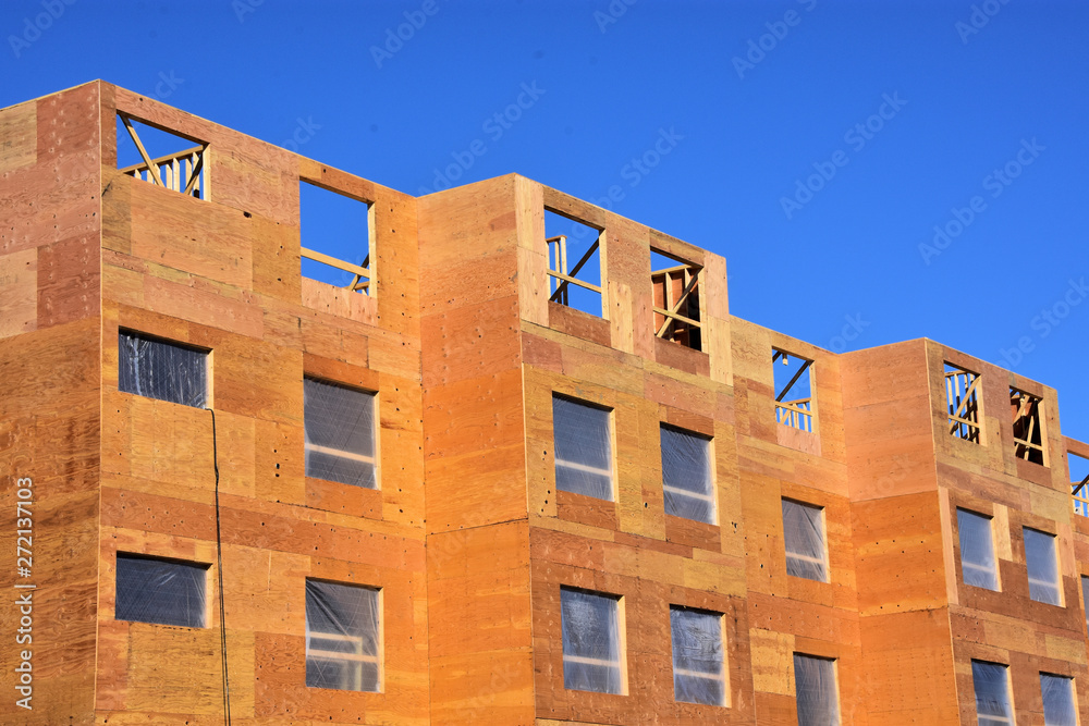 Wood frame multi story apartment building under construction. Wood frame multi story apartment building under construction.