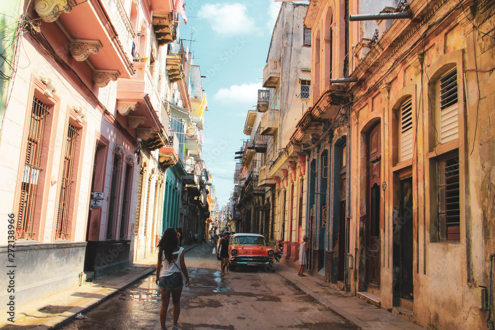 Colorful street and old car in Havana, Cuba