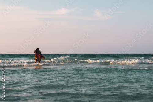 Girl with palm trees sunset in Caribbean © Alohadunya