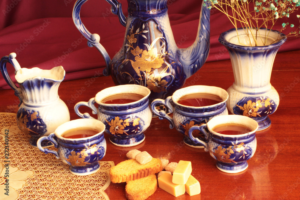 cup of tea and cookies on purple background cup of tea and cookies on purple background