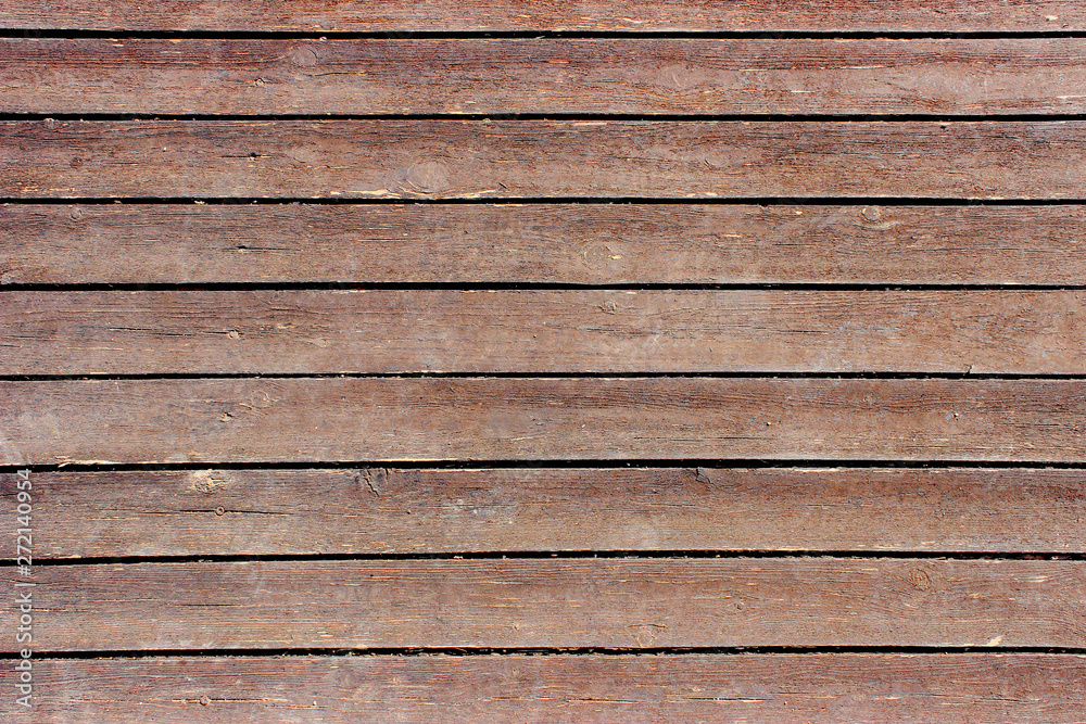 Brown wooden floor of horizontal boards Brown wooden floor of horizontal boards