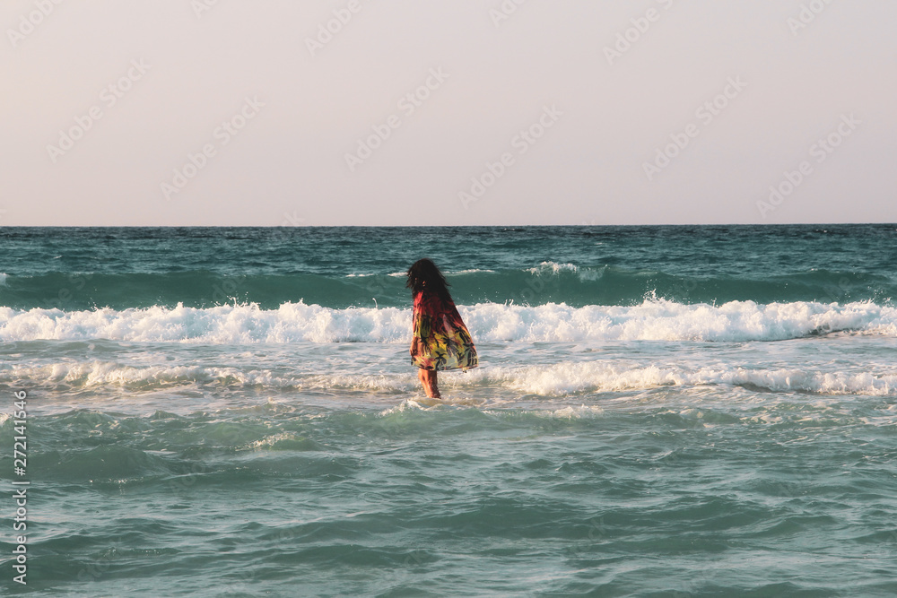 Girl with palm trees sunset in Caribbean Girl with palm trees sunset in Caribbean
