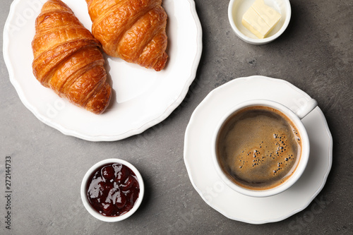 Fototapeta Naklejka Na Ścianę i Meble -  Flat lay composition with cup of coffee and croissants on grey background