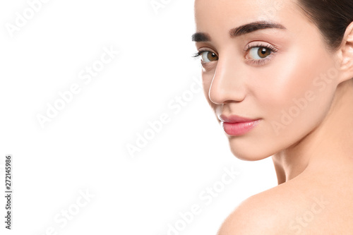 Portrait of young woman with beautiful face against white background